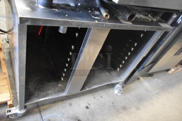 Rational SCC WE 62 stainless steel combi oven with UltraVent Plus hood on equipment stand, visible from side.