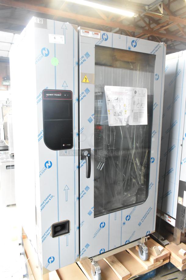 2023 Henny Penny FPGM22172007 stainless steel commercial convection oven, natural gas, 200,000 BTU, new with scratches.