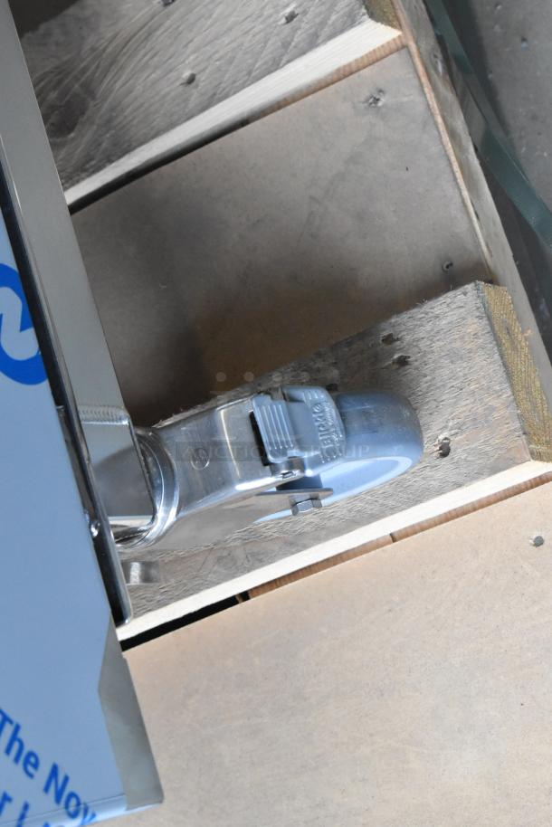 Henny Penny FPGM22172007 stainless steel combi oven wheel detail. Brand new, natural gas, 200,000 BTU, with pan rack.