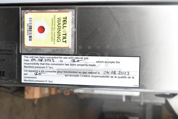 Brand new Henny Penny FPGM22172007 stainless steel combi convection oven, natural gas, 200,000 BTU, roll-in rack with pan transport. Includes conversion confirmation tag for natural gas use dated 04.08.2023.