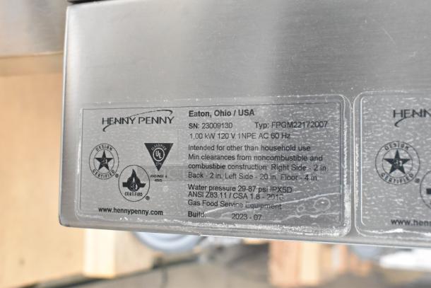 2023 Henny Penny FPGM22172007 stainless steel commercial gas convection oven tag showing model, type, and certifications.