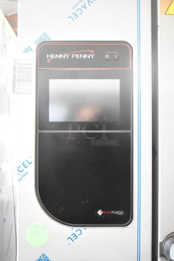 Brand new Henny Penny FPGM22172007 stainless steel commercial combi convection oven, 200,000 BTU, natural gas, with transport rack.