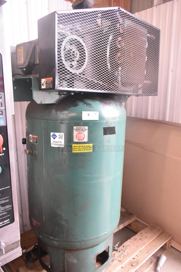 Champion VR10-12 metal air compressor, commercial floor style, 460 volts, 3 phase. Visible safety and asset ID tags.