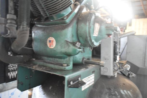 Champion VR10-12 reciprocating air compressor, metal, commercial floor style, 460V, 3-phase, visible wear and labels.