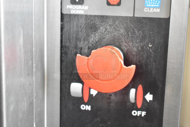 Hardt Inferno 4500 stainless steel rotisserie oven control panel with a red on/off dial and cleaning indicator.