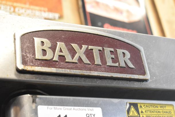 Baxter OV310G stainless steel commercial oven label, caution stickers visible, right side door non-functional.