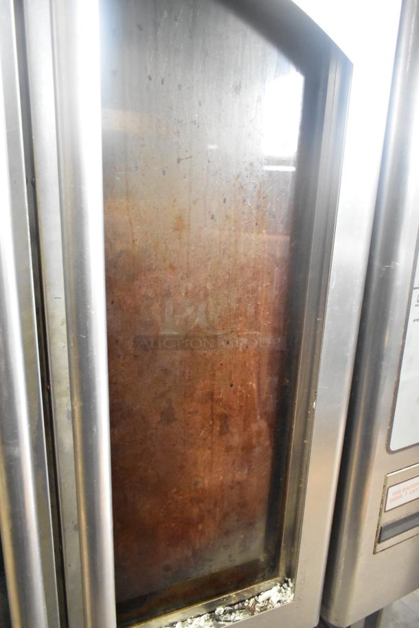 Baxter OV310G stainless steel commercial rack oven on double pan rack, natural gas powered. Right side door inoperable.