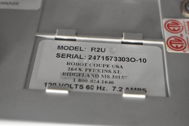 Robot Coupe R2U food processor label showing model, serial number, 120 volts, 60 Hz, and manufacturer details.