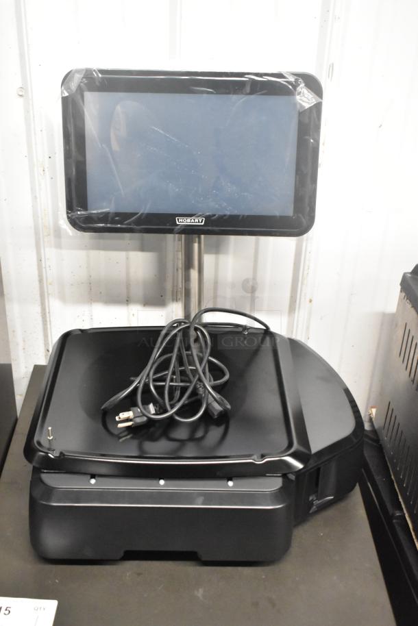 Brand new Hobart HTi-SSLSC 30 lb. metal commercial scale with label printer. Includes display screen, power cord; 120/208-240V.