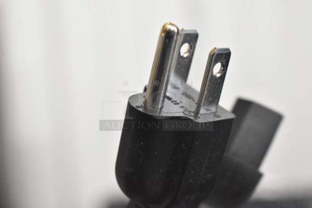 Close-up of the power plug for a Hobart HTi-SSLSC scale, highlighting prongs and voltage rating. New with slight scratches.