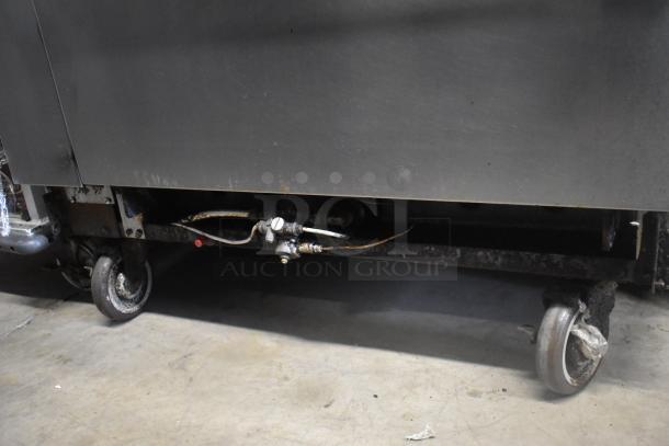 American Range 6-Burner Stainless Steel Commercial Range with Oven, over shelf, backsplash, on metal casters, used condition.