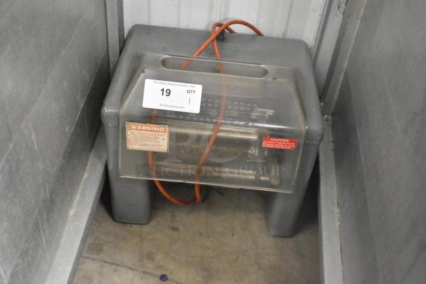 Metal commercial countertop electric meat tenderizer, 115 volts, 1 phase, visible caution labels.