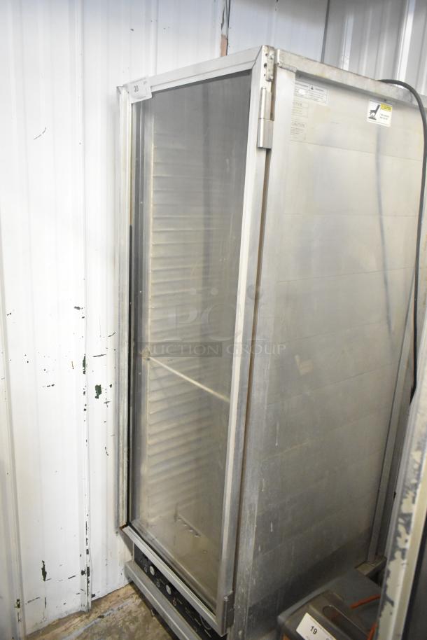 CresCor 118PH1834 metal heated holding cabinet with commercial casters. 120V, 1 phase. Used condition, with visible labels.