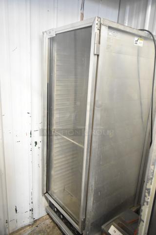 CresCor 118PH1834 metal heated holding cabinet with commercial casters. 120V, 1 phase. Used condition, with visible labels.