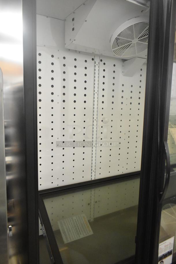True FLM-81F 3 Door Reach-In Freezer with poly-coated racks, 115 volts, 1 phase, commercial use, mint condition.