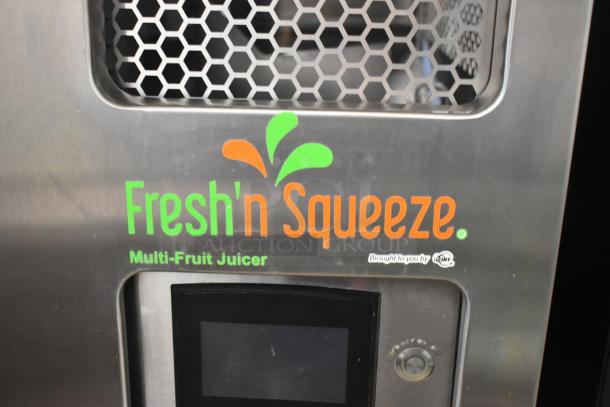 JBT 2ND-GEN-MFJ-HE Fresh N Squeeze stainless steel commercial citrus juicer, floor style, with digital screen and casters.