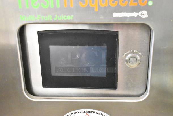 JBT 2ND-GEN-MFJ-HE stainless steel citrus juicer with touchscreen, fresh n squeeze label, power button. Commercial grade.