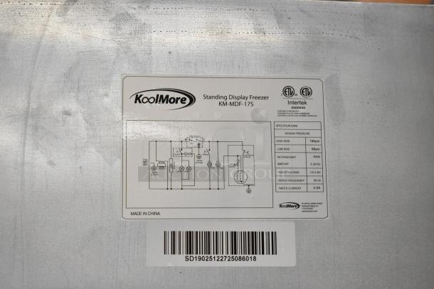 KoolMore KM-MDF-17S freezer label, 6.5 Cu. Ft., manual defrost, 115V, model specifications, and barcode visible.
