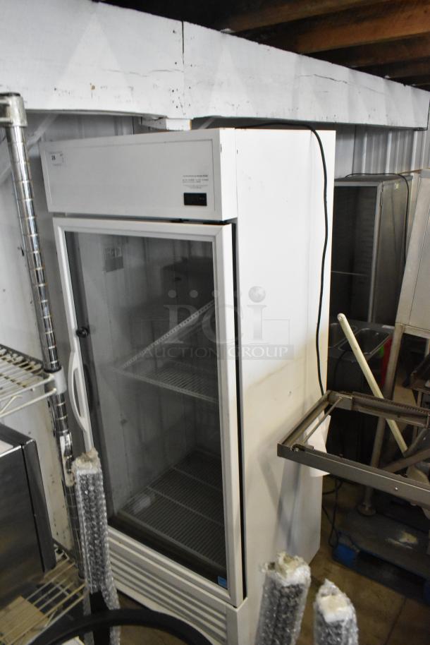 2021 True TSCI-600R-G-PH single door cooler merchandiser, glass door, poly coated racks, 115V, excellent condition.