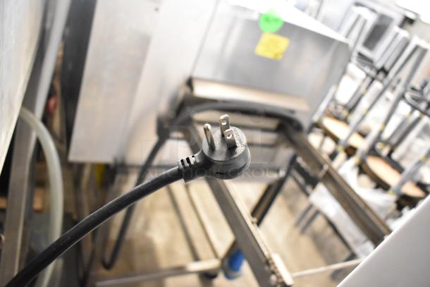 Plug of a 2021 True TSCI-600R-G-PH commercial cooler merchandiser with visible power details, 115 volts, 1 phase.