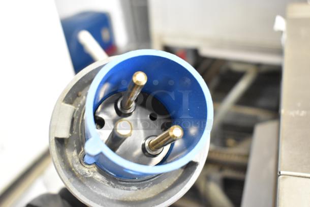 Close-up of a blue electrical plug for a Belshaw Adamatic TG-50 Thermoglazing Station. 208 volts, 1 phase.