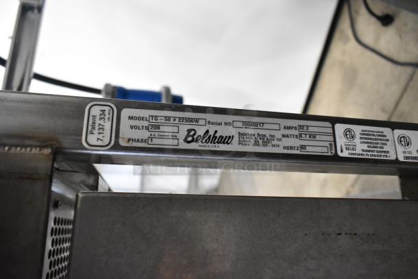 Belshaw Adamatic TG-50 thermoglazing station, stainless steel, commercial casters, 208V, 1 phase, model tag visible.