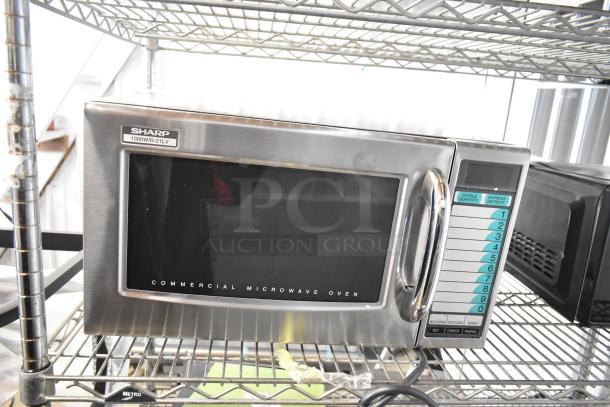 Sharp R-21LVF stainless steel commercial microwave, 2024 model, 120 volts, 1 phase. New condition, minor scratches.