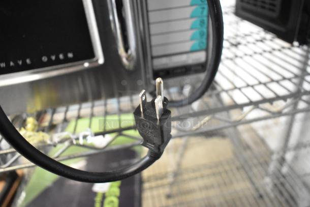 BRAND NEW Sharp R-21LVF stainless steel commercial microwave, 2024 model, 120 volts, 1 phase, with minor cosmetic defects.