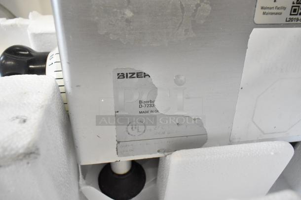 Bizerba metal commercial countertop meat slicer showing label with model D-7233, made in Germany. 115V, 1 phase.