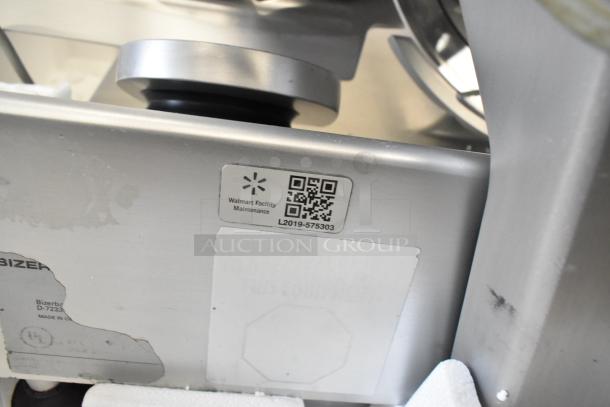 Bizerba commercial countertop meat slicer, 115 volts, 1 phase, metal construction, visible maintenance tag and markings.