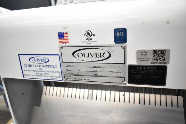 Oliver 797-32NC metal commercial bread loaf slicer in working condition, 115V, 1 Phase, visible tech support details.