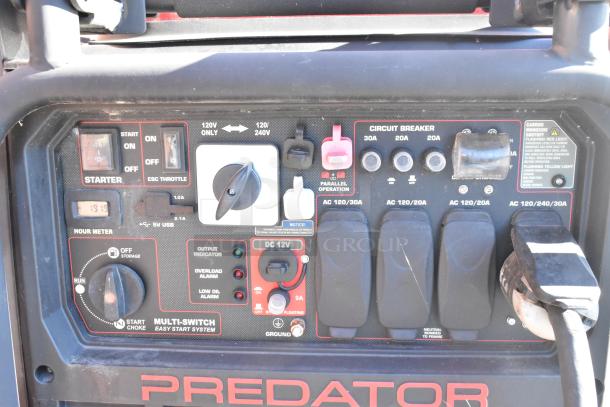 Predator generator control panel with multiple switches, circuit breakers, and a clear hour meter, suitable for a mobile kitchen setup.