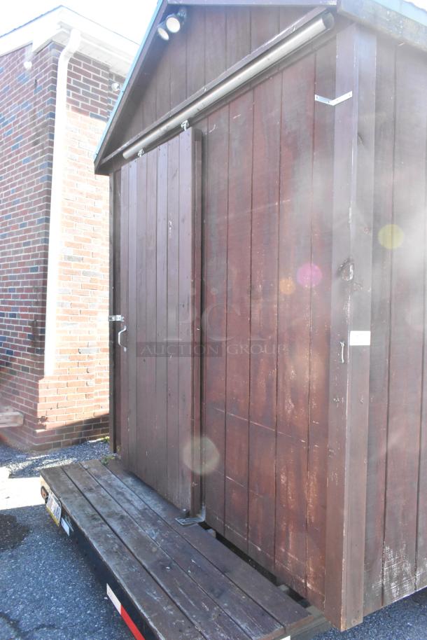 Fully outfitted food trailer with wood exterior. Includes Avantco cooler, ServIt steam table, food warmers, Predator generator.