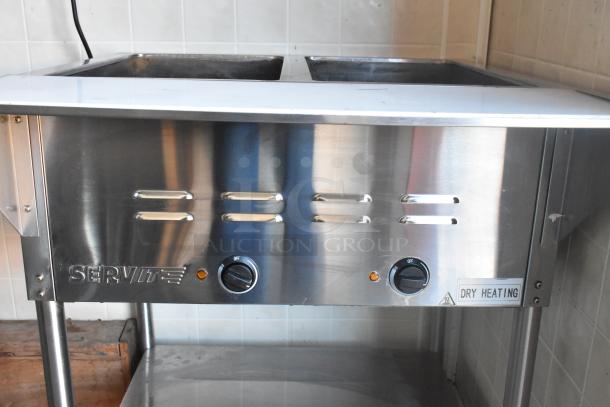 ServIt steam table with dry heating, stainless steel, dual dials for temperature control, part of a fully equipped food trailer.