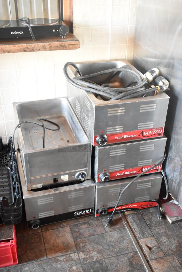 Stacked Avantco food warmers and a Galaxy warmer in a mobile kitchen. Includes power cords. Commercial-grade equipment.