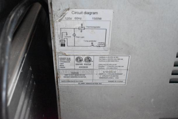 Label on equipment showing circuit diagram, voltage, and safety cautions. Contains ETL certification and manufacturing details.