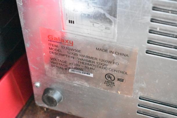 Metallic plaque on food warmer, labeled "Galaxy equipment, Model 12x20, 1200W," with technical specs and UL, NSF logos.