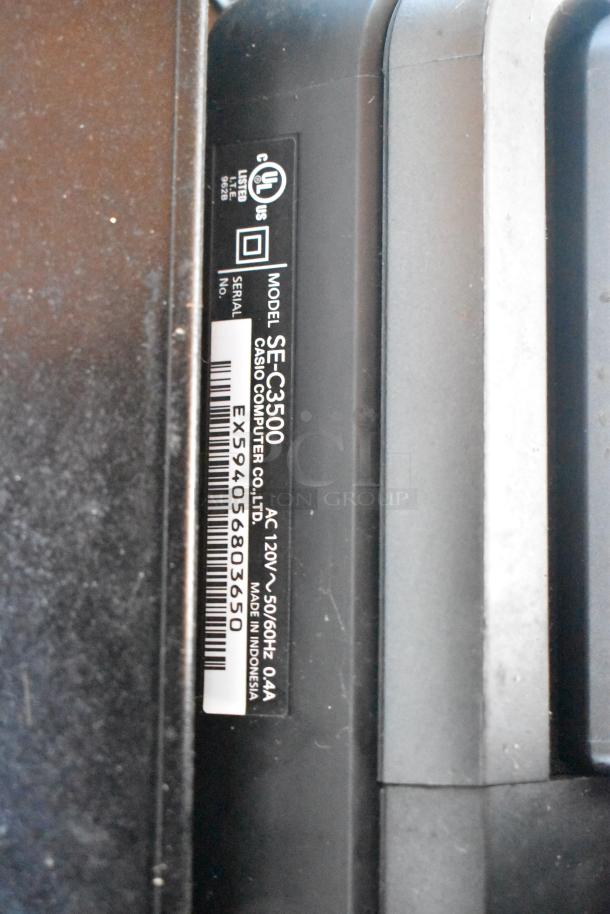 Close-up of a Casio SE-C3500 label showing model, serial number, and power specs: 120V, 50/60Hz, 0.4A.