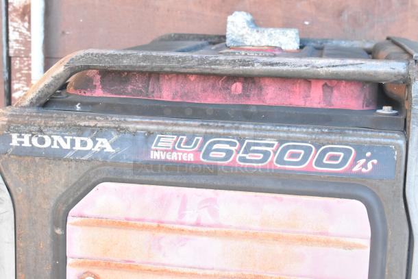 Close-up of a Honda EU6500is Inverter Generator, exhibiting noticeable rust and wear.
