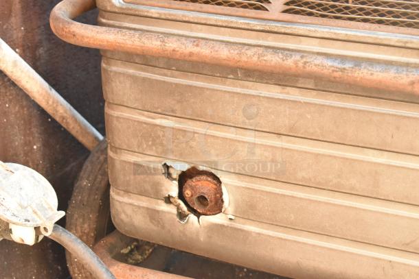 Close-up of exterior damage on a 2007 Lanchester food trailer, showing rust and a hole in the paneling.