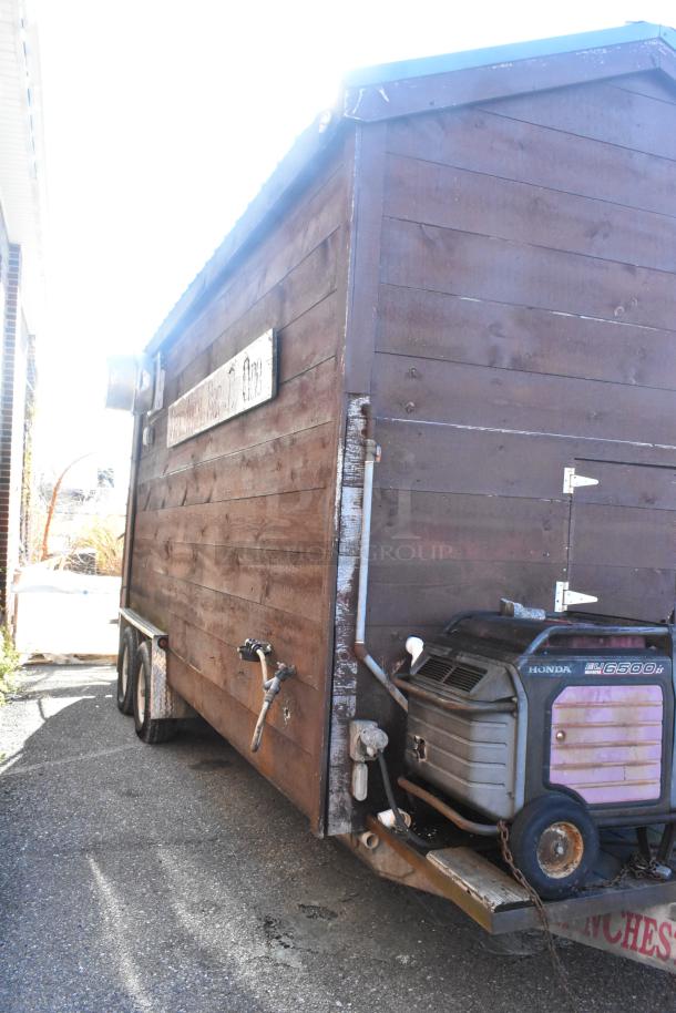 2007 Lanchester food trailer with wood exterior, Honda EU6500is generator attached; equipped with commercial kitchen.