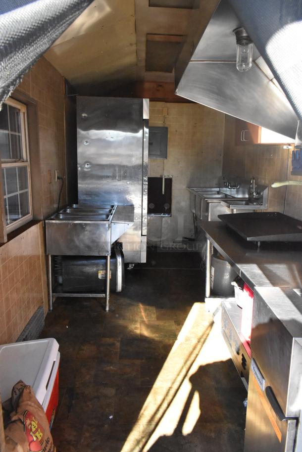 2007 Lanchester food trailer, equipped with Meadow Creek grill, PDI hood, Avantco cooler, ServIt steam table, Torrey scales.