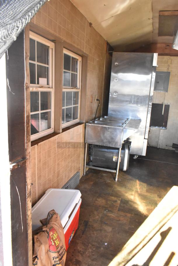 2007 Lanchester food trailer interior with stainless fixtures, including ServIt steam table and cooler. Good condition.