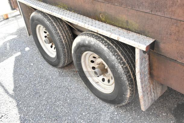 2007 Lanchester food trailer rear wheel section with dual tires and diamond-plated fender, showing used condition.