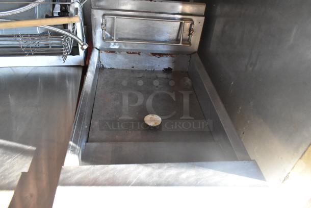 Interior of 2007 Lanchester food trailer showing durable stainless steel cooking area and workspace.