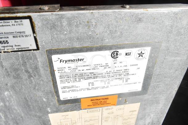 Label on Frymaster GF145D with serial no. 1211FM0063; shows gas-propane specs, certification marks, and installation info.