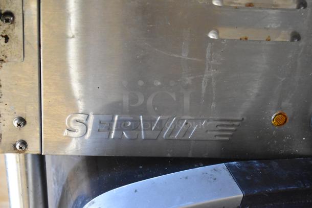 Stainless steel ServIt steam table with engraved logo on a fully outfitted 2007 Lanchester food trailer.