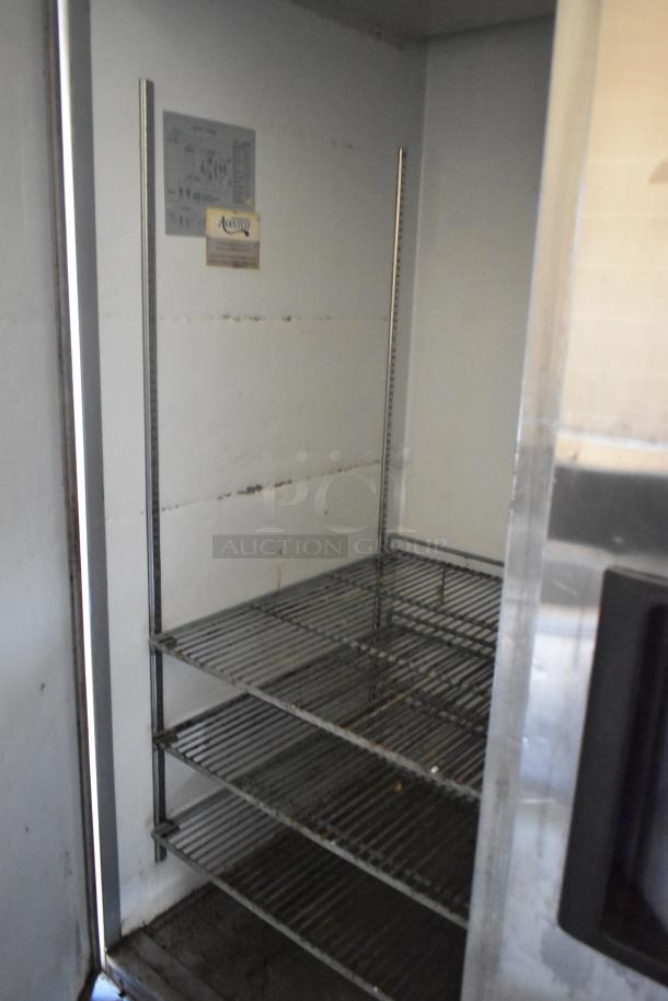 Interior view of Avantco 2 Door Cooler in 2007 Lanchester food trailer, showing wire shelving and Avantco label.