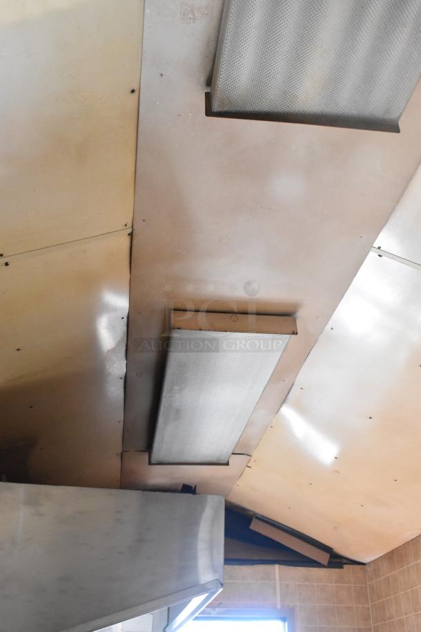 Ceiling view of a 2007 Lanchester food trailer, featuring installed fluorescent lighting and ventilation.