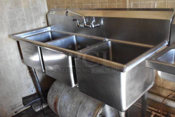 Stainless steel three-compartment sink in a 2007 Lanchester food trailer, used condition, ideal for mobile kitchen setups.